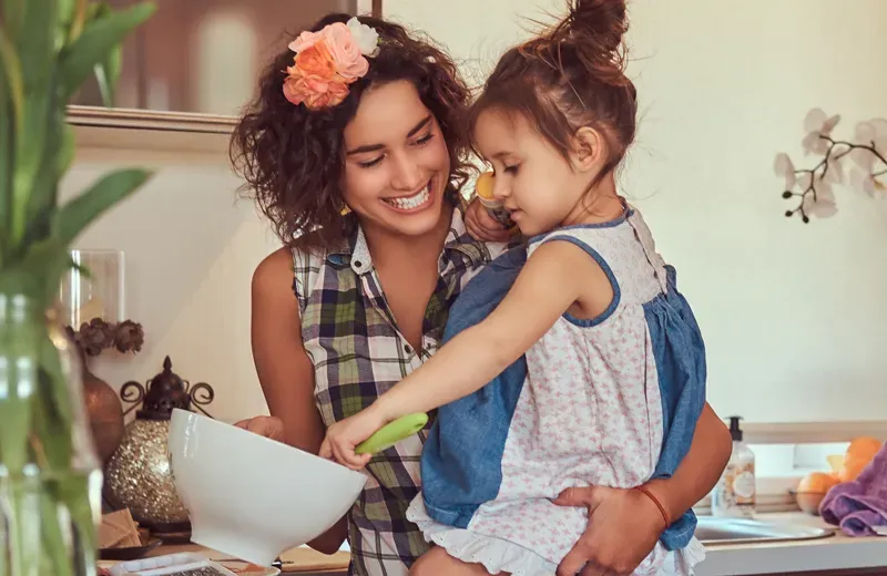 mother and daughter cooking