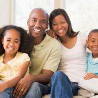 Family sitting on couch 