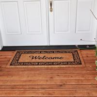 Welcome mat in front of door