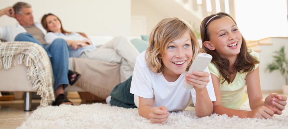 Family watching tv together