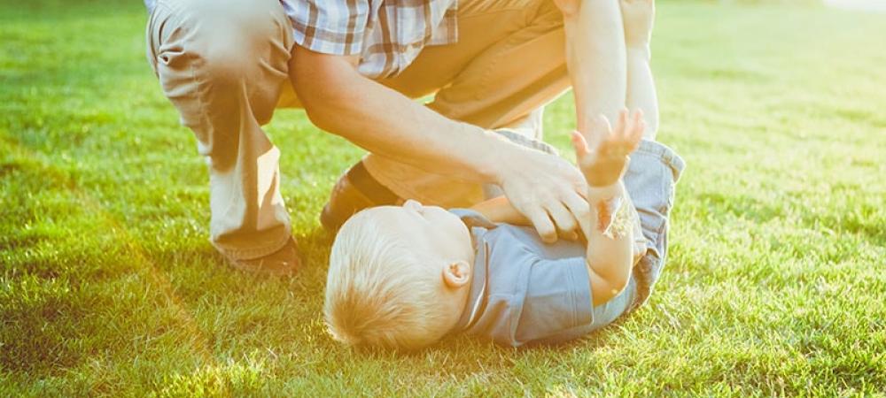 Father and son playing outside