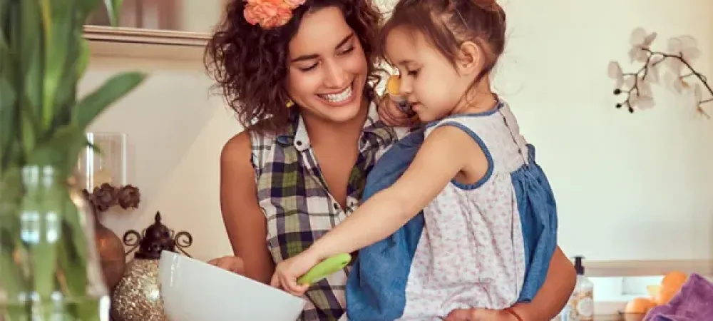 mother and daughter cooking