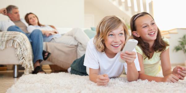 Family watching tv together