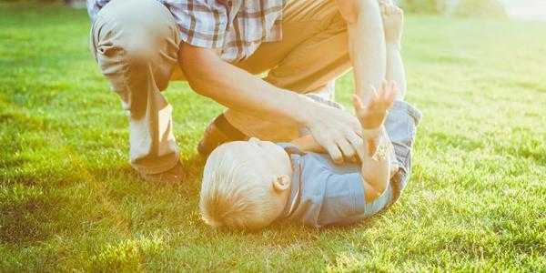 Father and son playing outside
